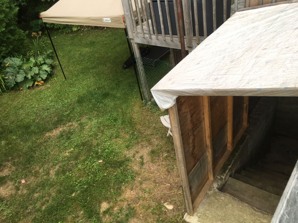 Photo of my basement stairs and tent shelter from above